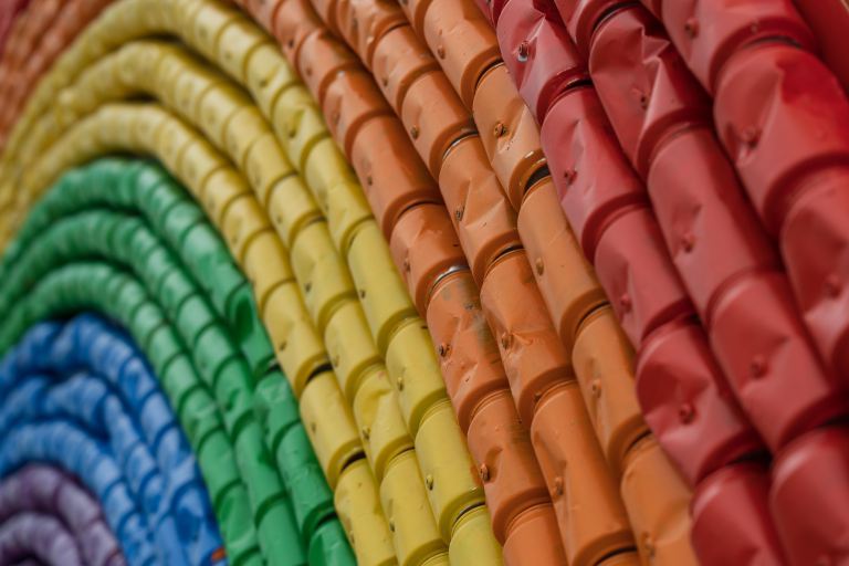 a rainbow of recycled cans
