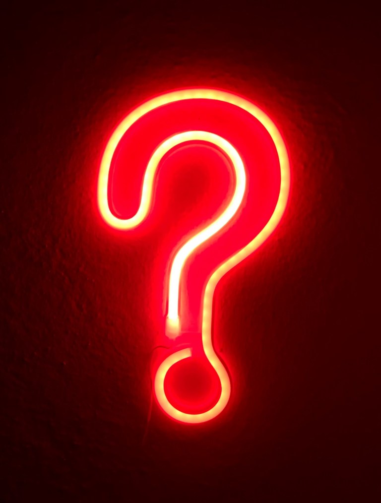 red neon sign question mark